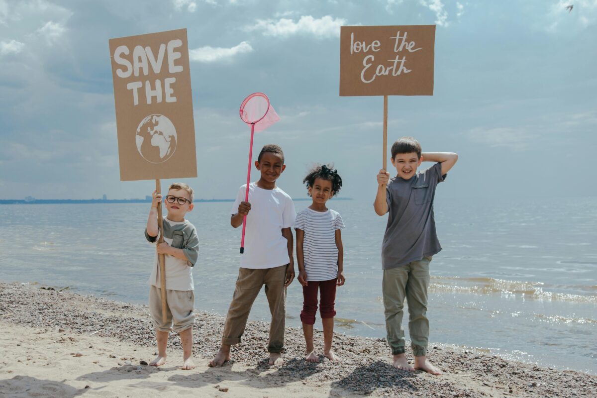 Kids picking up trash at the beach